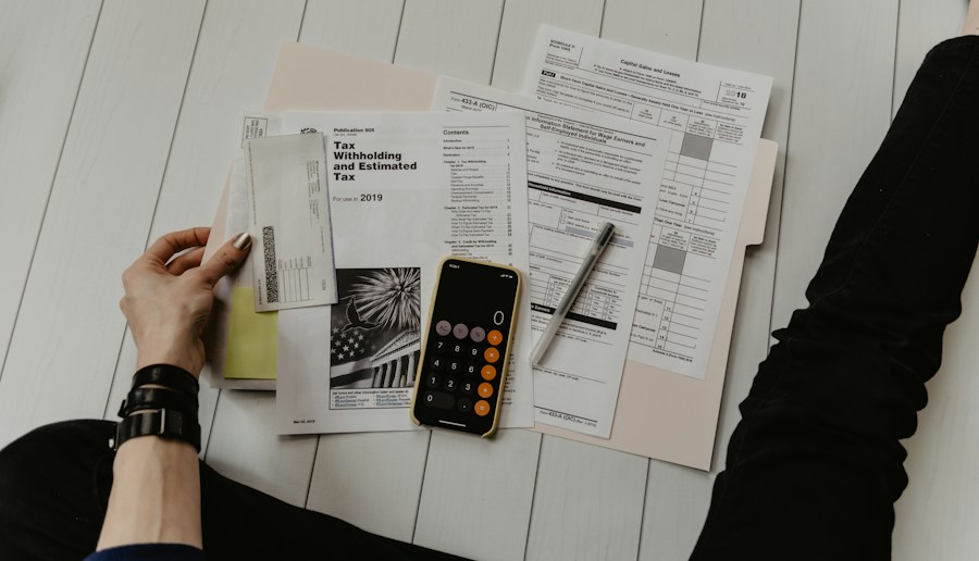 Bookkeeping paperwork, calculator and financial records